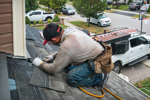 Professional Roof Replacement technician working in Wellsville, MO